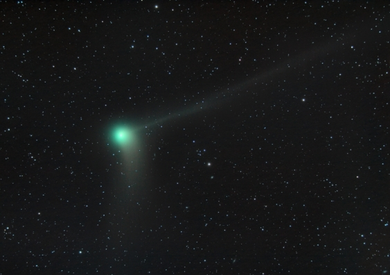 green comet with two tails flying through space shutterstock 2